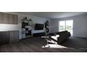 Living room with gray sofa, TV, and modern shelving at 13119 Cedar Elm Lane, Parrish, FL 34219