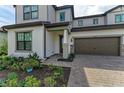 Two-story house with one-car garage and walkway at 16446 Slate Pl, Bradenton, FL 34211