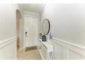 Bright and airy entryway with a decorative console table at 16706 Vardon Ter # 205, Bradenton, FL 34211