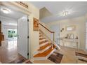 Elegant wooden staircase leading to the upper level of the home at 220 82Nd St, Holmes Beach, FL 34217