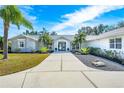 House with gray stone exterior and teal front door at 3520 Wilderness W Blvd, Parrish, FL 34219