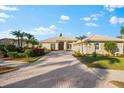 Attractive home with a large driveway and nicely landscaped yard at 4941 Bridgehampton Blvd, Sarasota, FL 34238