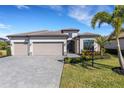 Attractive single-Gathering home with three-car garage and landscaped yard at 5035 Seafoam Trl, Bradenton, FL 34211