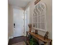 Charming entryway with a rustic console table and mirror at 5233 Blossom Cv, Lakewood Ranch, FL 34211