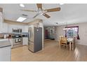 Kitchen boasts stainless steel appliances and white cabinets at 6824 Jarvis Rd, Sarasota, FL 34241