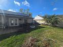 Backyard patio with a fire pit and a pergola at 7561 120Th Ave, Largo, FL 33773