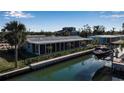 Stunning canal-front property with private boat dock and lush landscaping at 765 Saint Judes N Dr, Longboat Key, FL 34228