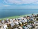 Aerial view of neighborhood and ocean, the home is circled in white at 866 N Shore Dr, Anna Maria, FL 34216