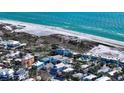 Aerial view of a charming beach house, near the sandy beach and beautiful ocean at 126/128 Avenida Veneccia, Sarasota, FL 34242