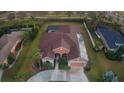 Aerial view showcasing the house, pool, and surrounding landscape at 13207 49Th E Ln, Parrish, FL 34219