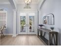 Bright and airy entryway with double doors and light flooring at 14721 Bowfin Ter, Lakewood Ranch, FL 34202