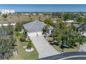 Spacious home with a large driveway and mature trees on a large lot at 1929 24Th Street W Cir, Palmetto, FL 34221