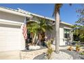 Inviting front entrance with palm trees and a brick walkway at 1929 24Th Street W Cir, Palmetto, FL 34221