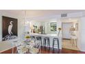 Bright, updated kitchen with white cabinets and eat-in area at 307 Timberlake Dr # 307, Bradenton, FL 34210
