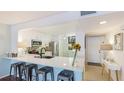 Modern kitchen featuring white cabinetry, stainless steel appliances and breakfast bar at 307 Timberlake Dr # 307, Bradenton, FL 34210