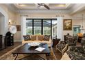 Spacious living room with large windows and access to pool area at 4022 Mayors Ct, Sarasota, FL 34240