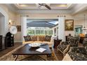 Spacious living room with large windows and access to pool area at 4022 Mayors Ct, Sarasota, FL 34240