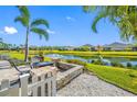 Relaxing patio with fire pit overlooking a lake at 4138 Deep Creek Ter, Parrish, FL 34219