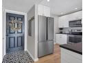 Entryway with stylish patterned floor and modern front door at 4500 Gulf Of Mexico Dr # 305, Longboat Key, FL 34228
