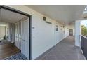 Condo hallway with access to unit and extra storage at 4500 Gulf Of Mexico Dr # 305, Longboat Key, FL 34228
