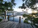 Serene waterfront view with a dock and resort in the background at 511 56Th St, Holmes Beach, FL 34217