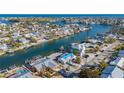 Aerial view of waterfront home with private dock and boat at 526 67Th St, Holmes Beach, FL 34217