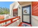 Condo entrance with a black metal door and a charming wreath at 535 Spring Lakes Blvd, Bradenton, FL 34210