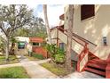 Condo building exterior showcasing walkway and landscaping at 535 Spring Lakes Blvd, Bradenton, FL 34210