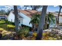 Well-maintained home nestled amongst lush landscaping and large trees at 5807 Garden Lakes Fern # 5807, Bradenton, FL 34203