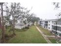 Community with lush landscaping and walkways at 5904 17Th W St # C34, Bradenton, FL 34207