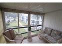 Relaxing screened balcony with seating and courtyard views at 5904 17Th W St # C34, Bradenton, FL 34207