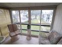 Relaxing screened balcony with seating and courtyard views at 5904 17Th W St # C34, Bradenton, FL 34207