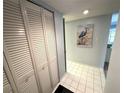 Bright entryway with tile flooring and built-in storage at 6120 43Rd W St # 101B, Bradenton, FL 34210