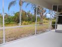 Spacious screened porch overlooking a grassy backyard at 7212 Southgate Ct, Sarasota, FL 34243