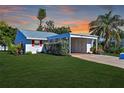Charming ranch home with carport and landscaped lawn at 9413 Andover Cir, Bradenton, FL 34210