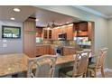 Updated kitchen with granite counters and stainless steel appliances at 9413 Andover Cir, Bradenton, FL 34210