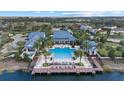 Resort-style community pool with dock and surrounding homes at 12029 Perennial Pl, Bradenton, FL 34211