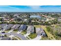 Aerial view of community with lake and ocean views at 15305 Isla Palma Ln, Nokomis, FL 34275