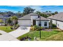 Single-story house with white exterior and gray roof at 15305 Isla Palma Ln, Nokomis, FL 34275