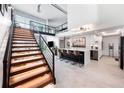 Modern kitchen with island and loft stairs at 1990 Main St # 6, Sarasota, FL 34236