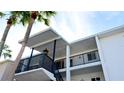 Close-up view of condo entrance with brick accents and staircase at 2044 Canal Dr # M37, Bradenton, FL 34207