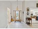 Bright entryway with tile floors and stained glass door at 21264 Wynyard Ave, Port Charlotte, FL 33954