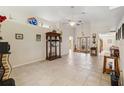 Spacious living room with tile floors and ceiling fan at 21264 Wynyard Ave, Port Charlotte, FL 33954