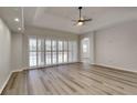 Living room with pool view, light floors, and plantation shutters at 2914 112Th E Ter, Parrish, FL 34219