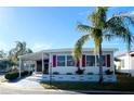 Front view of manufactured home, landscaped at 3230 Banyan Ter, Sarasota, FL 34237