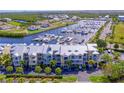 Beautiful aerial view of waterfront condos and boat docks, perfect for boating enthusiasts at 423 Bahia Beach Blvd, Ruskin, FL 33570