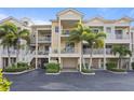 Condo building with private parking and lush landscaping at 423 Bahia Beach Blvd, Ruskin, FL 33570