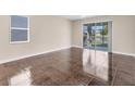 Bright living room with tile floors and sliding glass doors at 4711 Garden Arbor Way, Bradenton, FL 34203