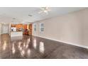 Open living space with kitchen view and tile flooring at 4711 Garden Arbor Way, Bradenton, FL 34203