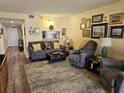 Comfortable living room featuring hardwood floors and stylish furnishings at 4900 38Th S Way # 201, St Petersburg, FL 33711